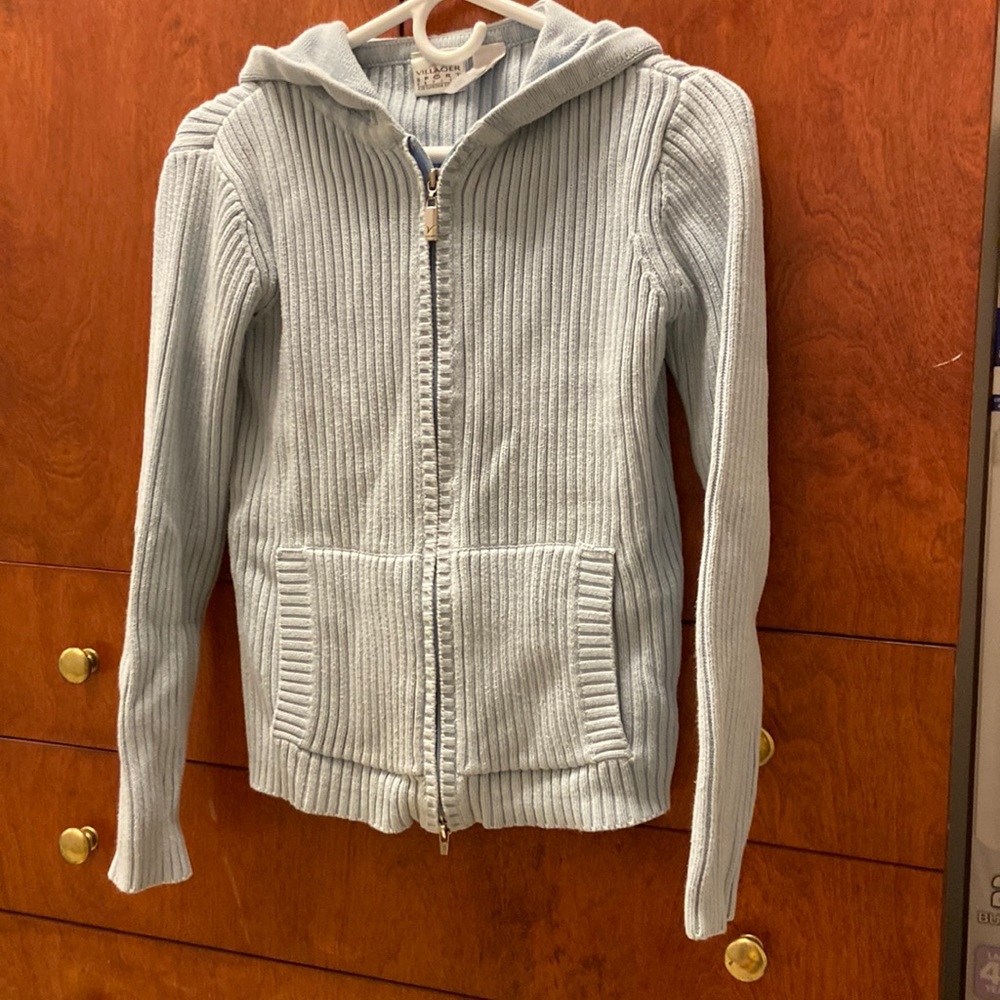 light blue sweater with hood.  Zip closure.  Slant pockets